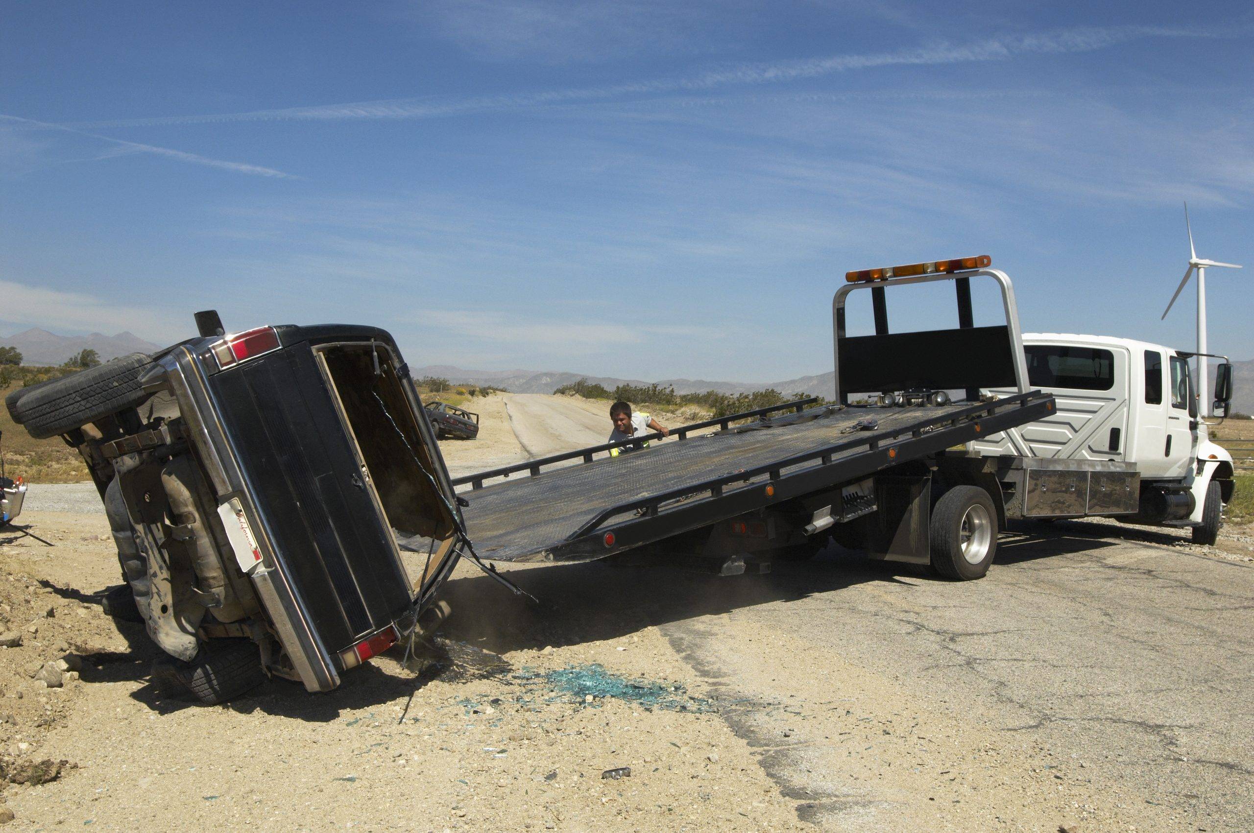 Man Preparing Tow Truck
